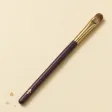 A small, flat, tongue-shaped concealer brush.