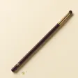 A slim eye brush ending in a tiny, dense, domed smudger tuft.
