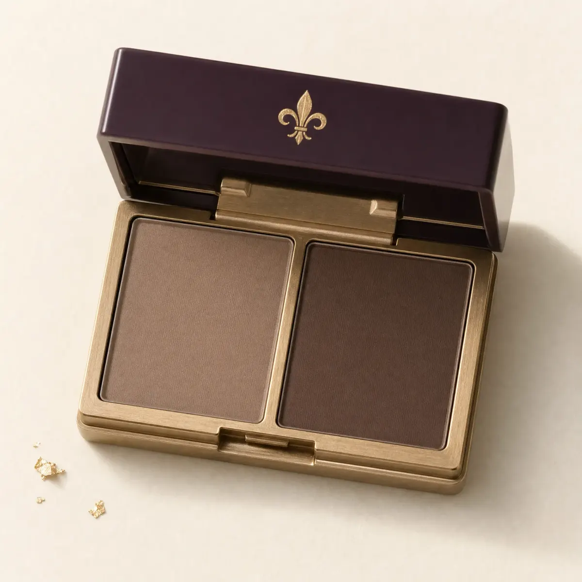 An open compact of two matte brow powders, taupe and brown.