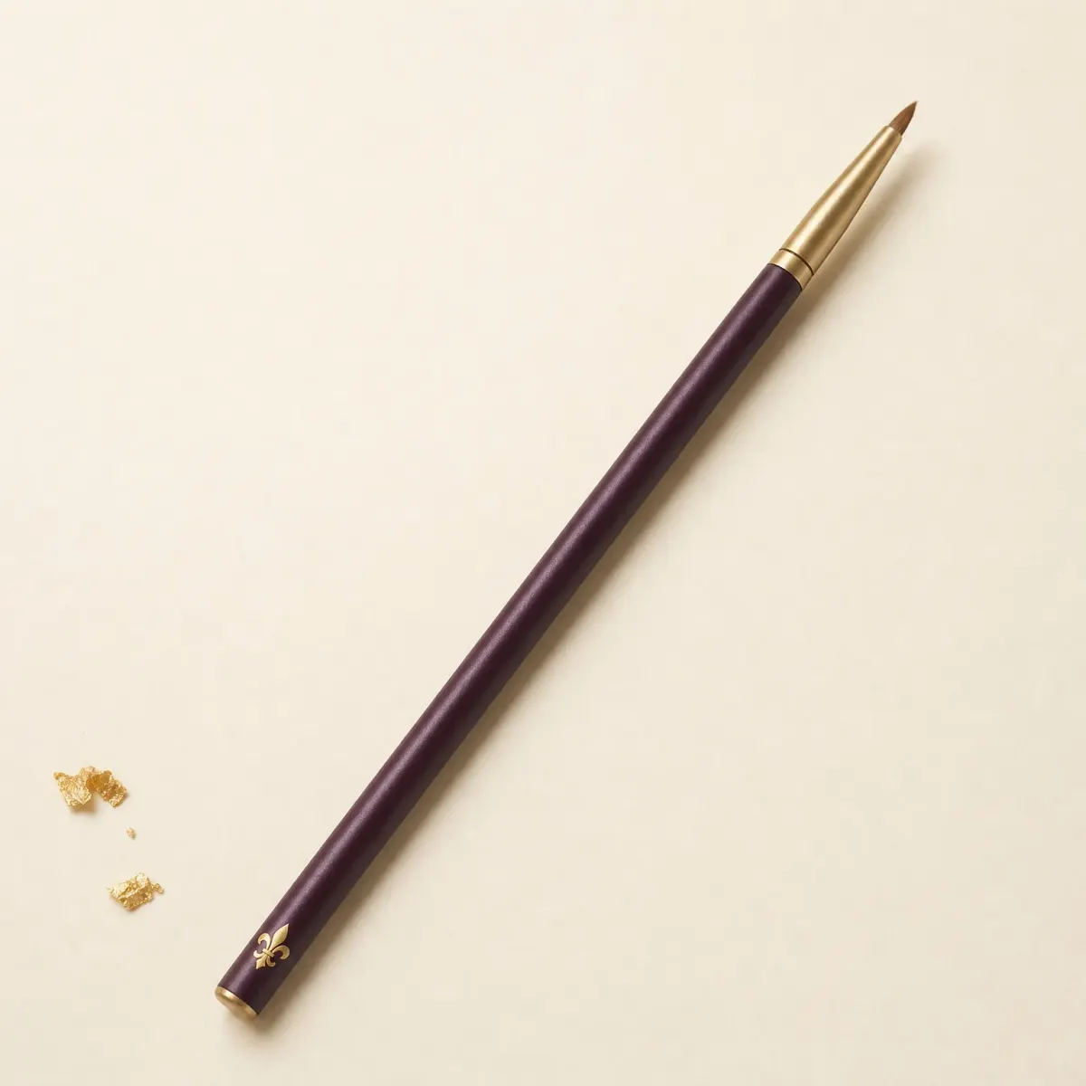 A slim eye brush with a dense, pencil-pointed tip.