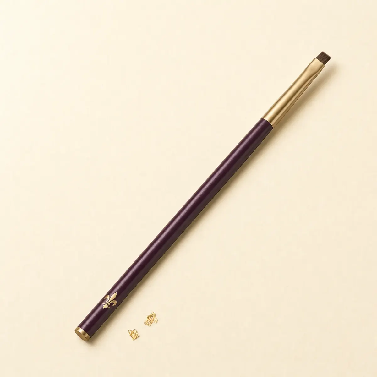 A slim brush with a tiny, square-cut definer head.
