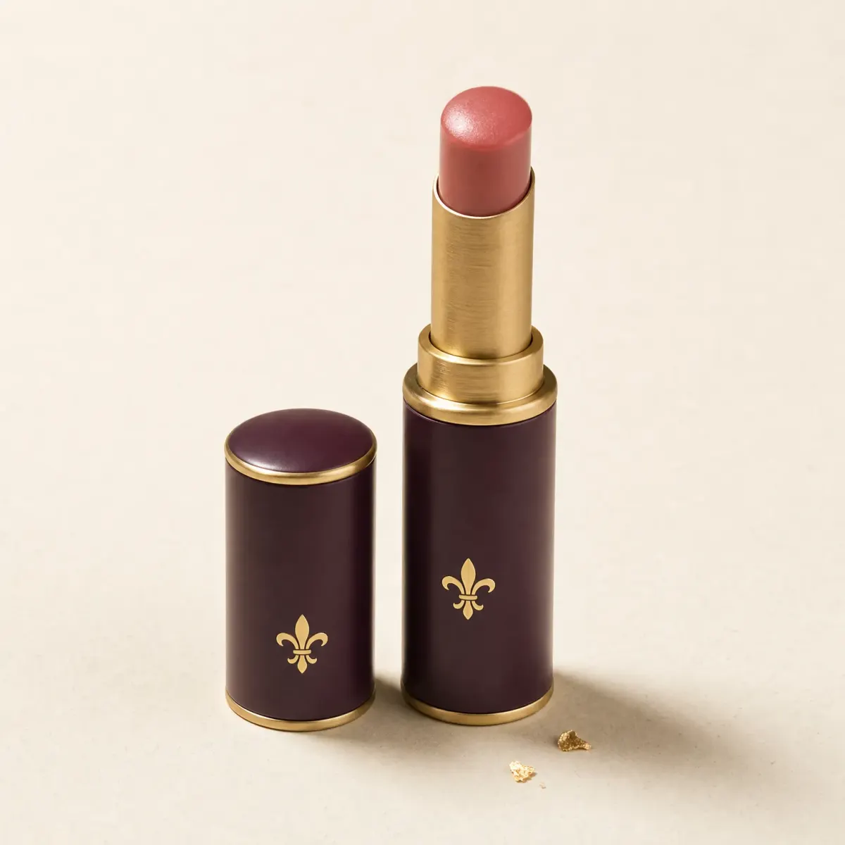An uncapped slim stick of rosy tinted lip balm.