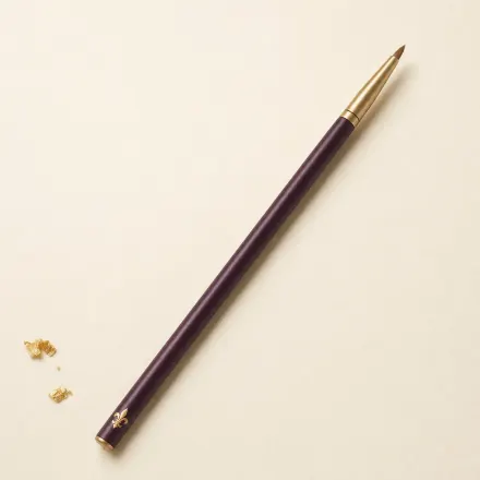 A slim eye brush with a dense, pencil-pointed tip.