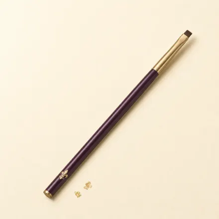 A slim brush with a tiny, square-cut definer head.