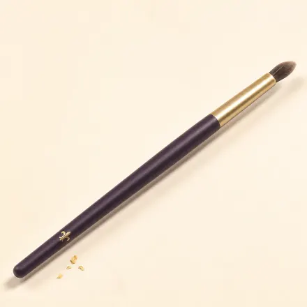 A small, dense, tapered nose contour brush.
