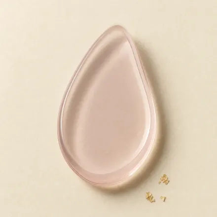 A translucent silicone makeup applicator.