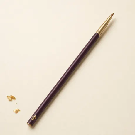 Illustration: A slim eye brush with a dense, pencil-pointed tip.