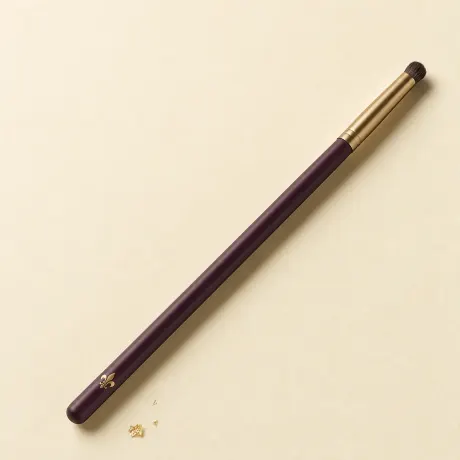 Illustration: A slim eye brush ending in a tiny, dense, domed smudger tuft.
