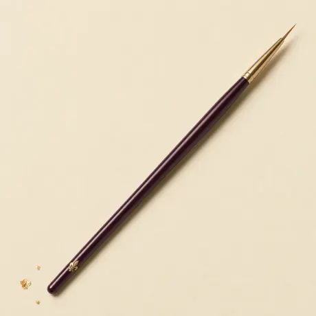 Illustration: A slim brush with a very fine, pointed liner tip.