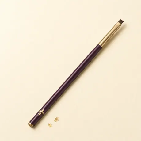 Illustration: A slim brush with a tiny, square-cut definer head.
