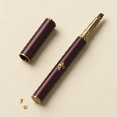 Illustration: A small retractable lip brush with its cap beside it.