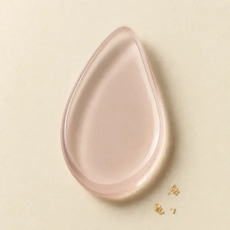 A translucent silicone makeup applicator.